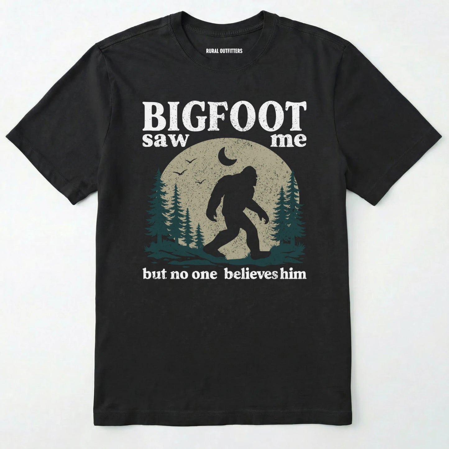 Black bigfoot saw me shirt with a vintage outdoor sasquatch in the forest graphic on a white background.