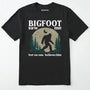 Black bigfoot saw me shirt with a vintage outdoor sasquatch in the forest graphic on a white background.