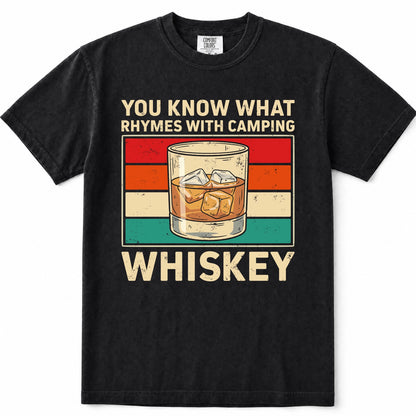 Black short-sleeve t-shirt with a vintage-style graphic print that reads 'YOU KNOW WHAT RHYMES WITH CAMPING WHISKEY' around an illustration of a whiskey glass. The shirt is shown flat against a plain white background.