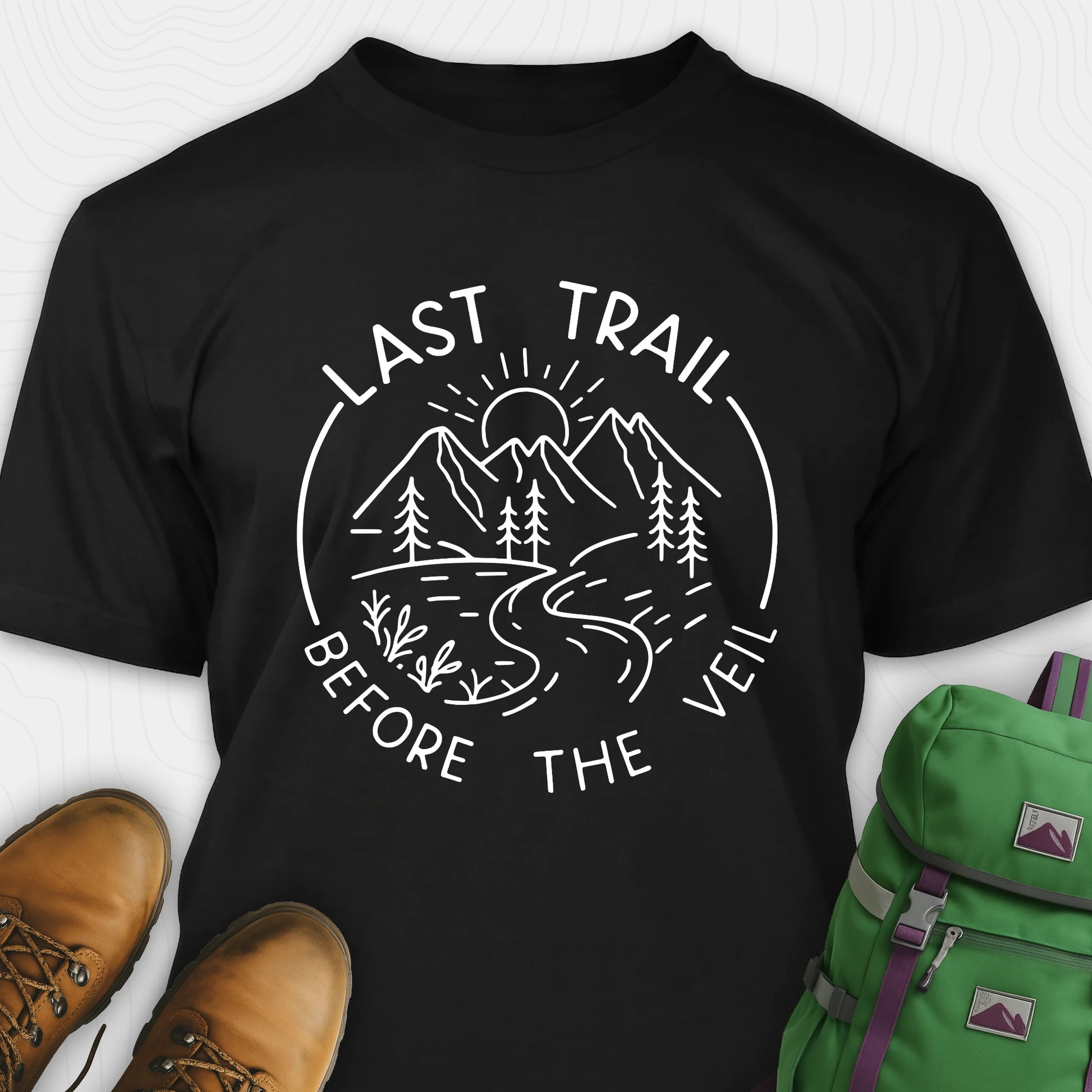 Black nature-themed Last Trail Before the Veil shirt with line-art mountain scene.