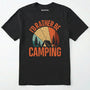 Black t-shirt with 'i'd rather be camping' design, green backpack, and brown boots on a white background