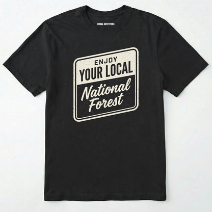 Black t-shirt with 'enjoy your local national forest' text on a white background