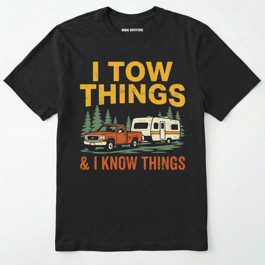 Black I Tow Things & I Know Things t-shirt with graphic of a truck towing a camper on a white background.