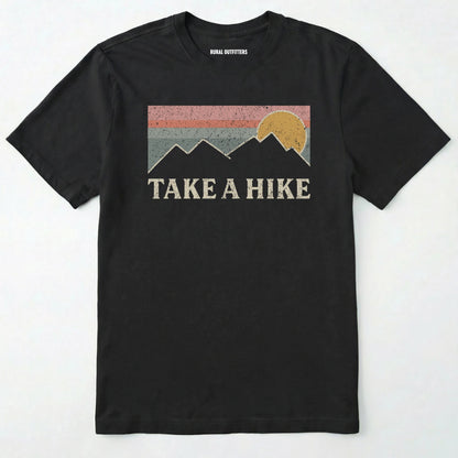 Black take a hike shirt with retro sunset and mountain graphic on a white background.