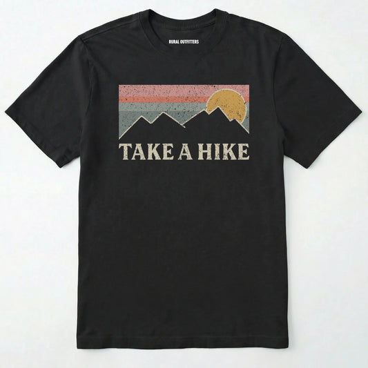 Black take a hike shirt with retro sunset and mountain graphic on a white background.
