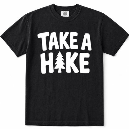 Black short-sleeve crewneck t-shirt with a white graphic print on the front that reads 'TAKE A HAKE' with a pine tree icon representing the letter 'I'.