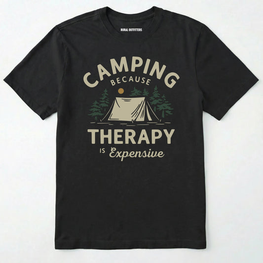 Black camping therapy shirt with a tent and pine trees design and "camping because therapy is expensive" text on a white background.