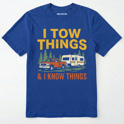 Royal I Tow Things & I Know Things t-shirt with graphic of a truck towing a camper on a white background.