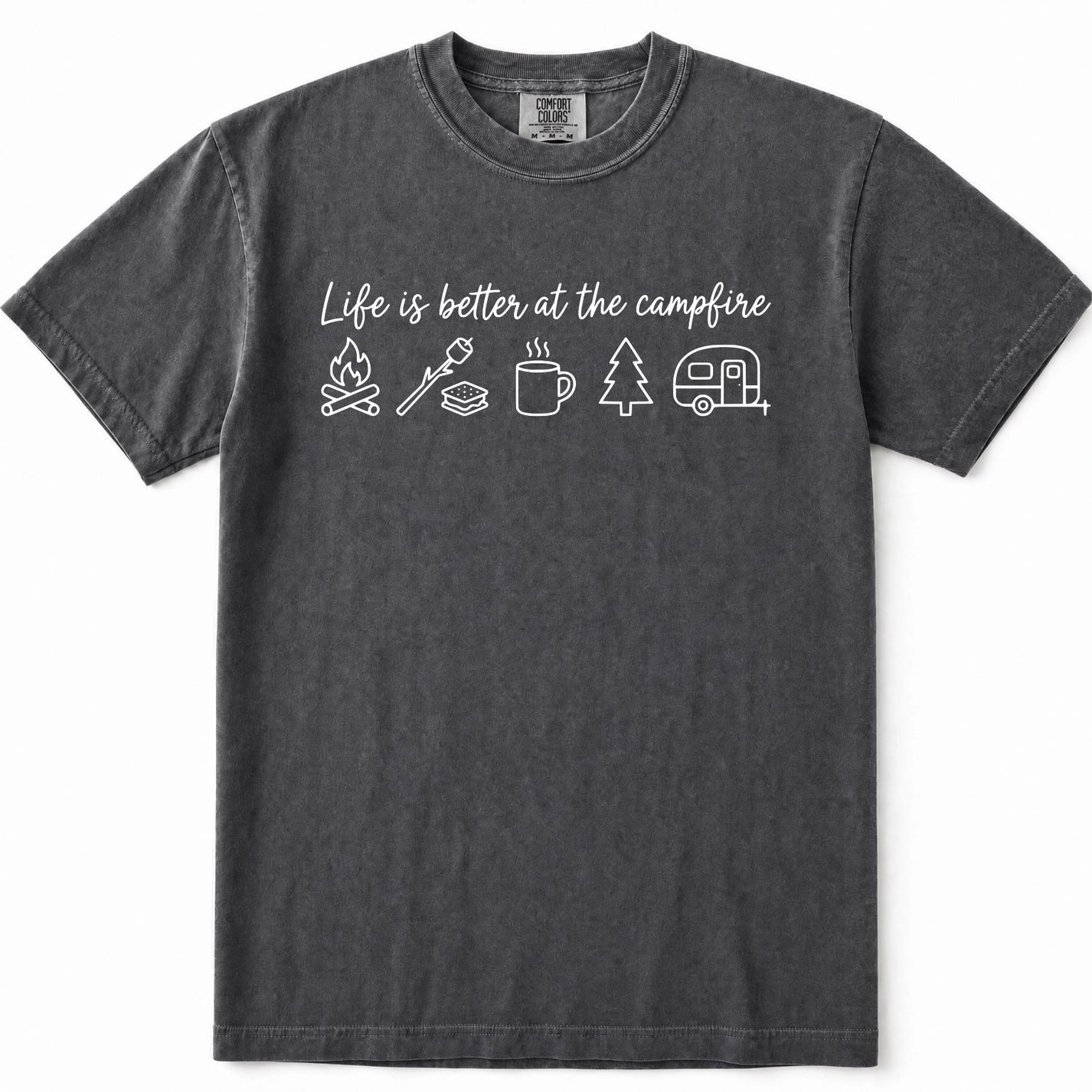 Pepper t-shirt with a white graphic print that reads 'Life is better at the campfire' above simple line drawings of a campfire, roasting marshmallow, mug, pine tree, and camper trailer.