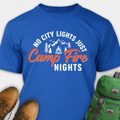 Blue campfire shirt with mountains and trees design and "No city lights just campfire nights" text