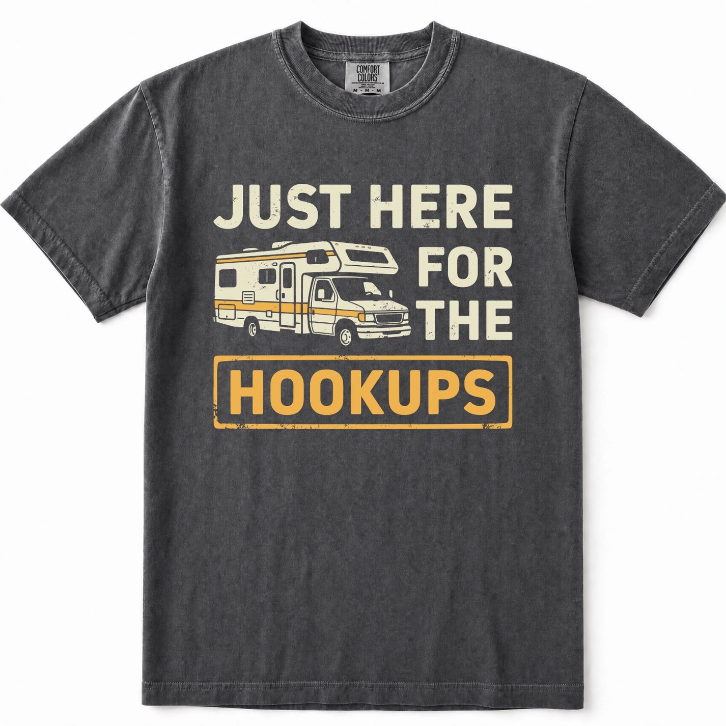 Grey mineral-wash t-shirt with a vintage-style graphic that reads 'JUST HERE FOR THE HOOKUPS' in cream and yellow text, featuring an illustration of a camper van in the center.