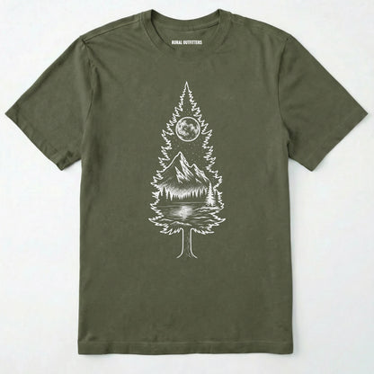 Military Green tree t-shirt featuring a detailed white graphic of a pine tree silhouette. the tree outline contains a landscape scene: a mountain peak rising over a forested shoreline, with its reflection visible in a lake below. above the mountain is a starry night sky and a full or partial circle representing the moon or sun.