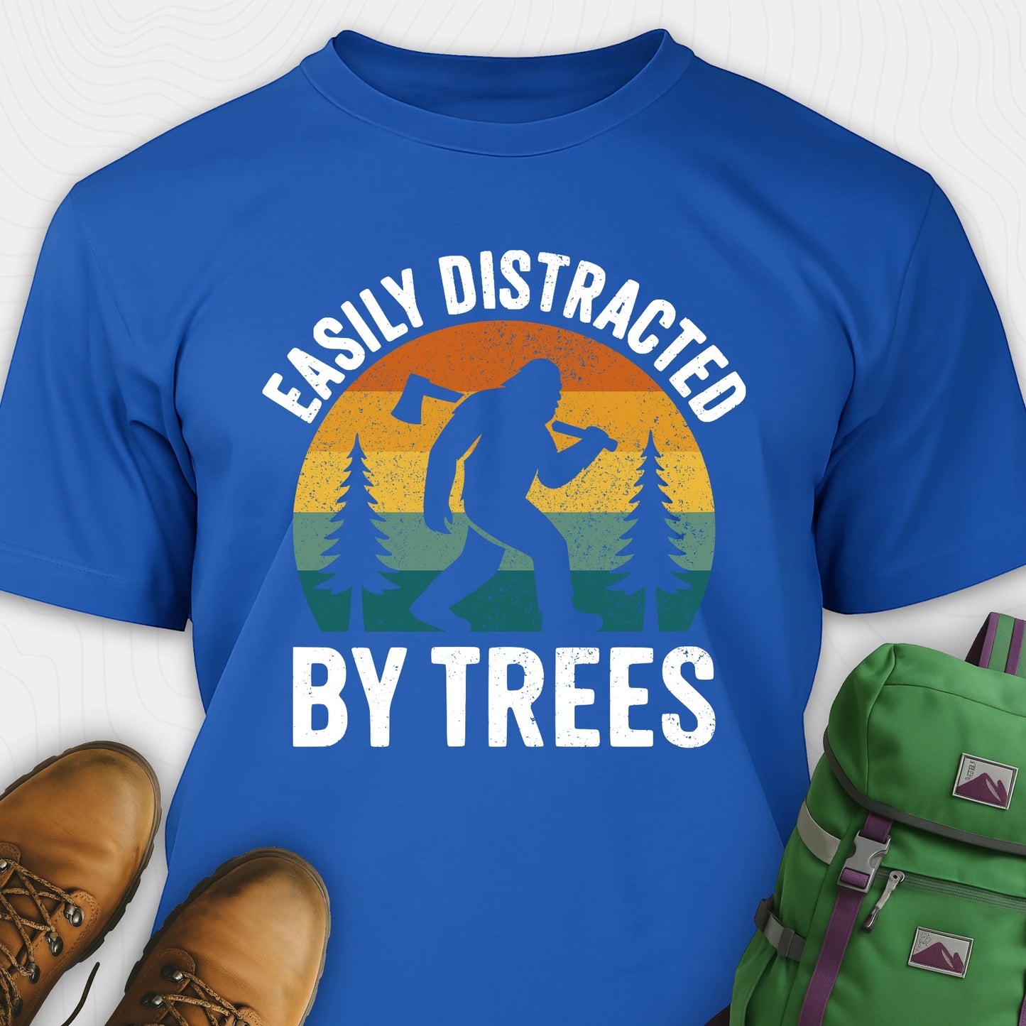 Blue funny sasquatch shirt featuring bigfoot silhouette and trees