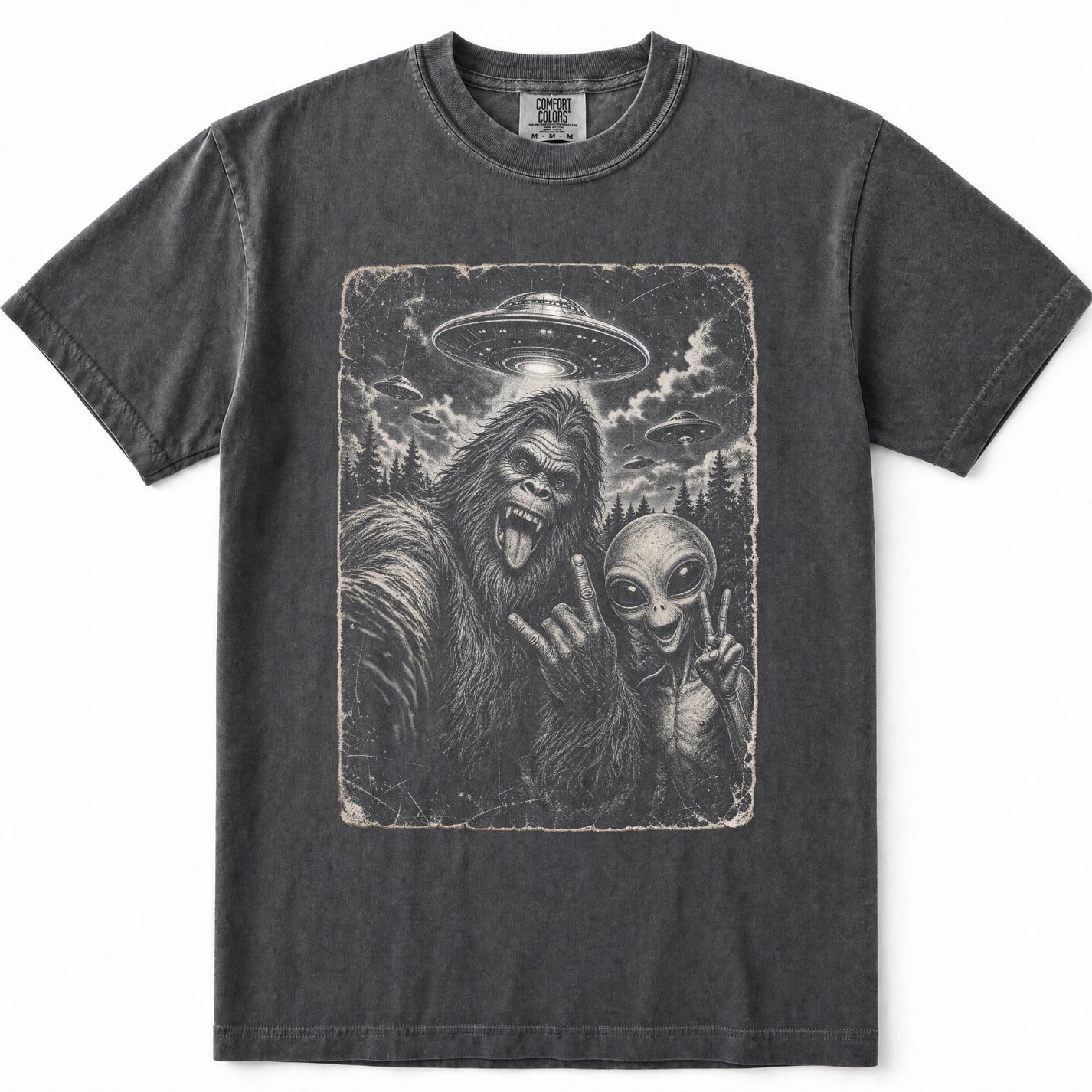 Pepper crewneck t-shirt featuring a vintage-style graphic print of Bigfoot and an alien making peace signs, with a UFO in the sky above.