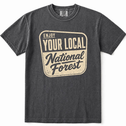 Grey washed short-sleeve t-shirt with a distressed cream-colored graphic on the front that reads 'ENJOY YOUR LOCAL National Forest'.