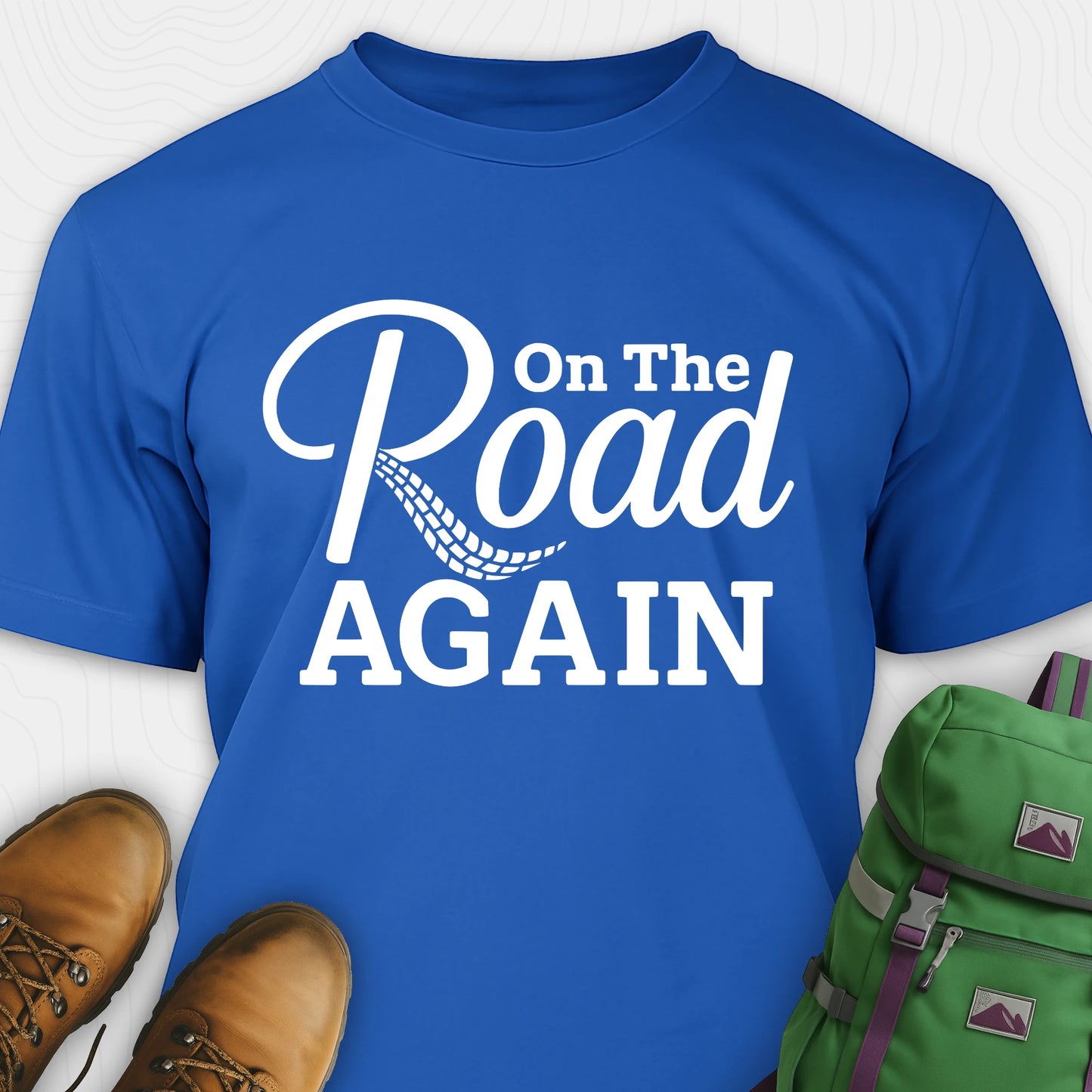 Blue road trip t-shirt with “on the road again” white text