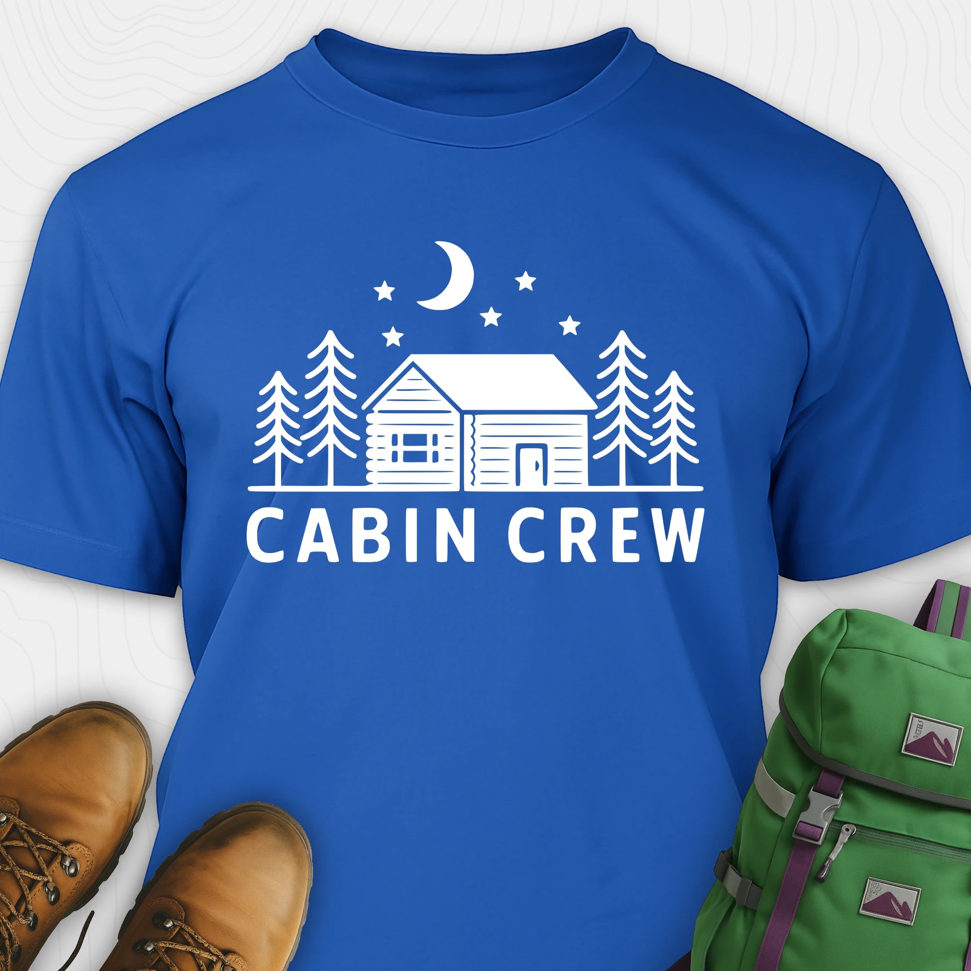 Blue cabin crew t-shirt with moon, pine trees and cabin design