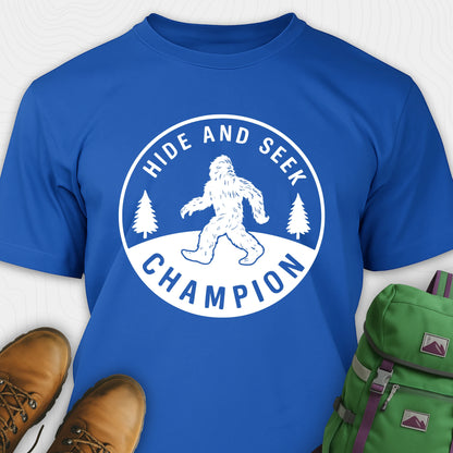 Blue bigfoot hide and seek champion shirt with forest emblem