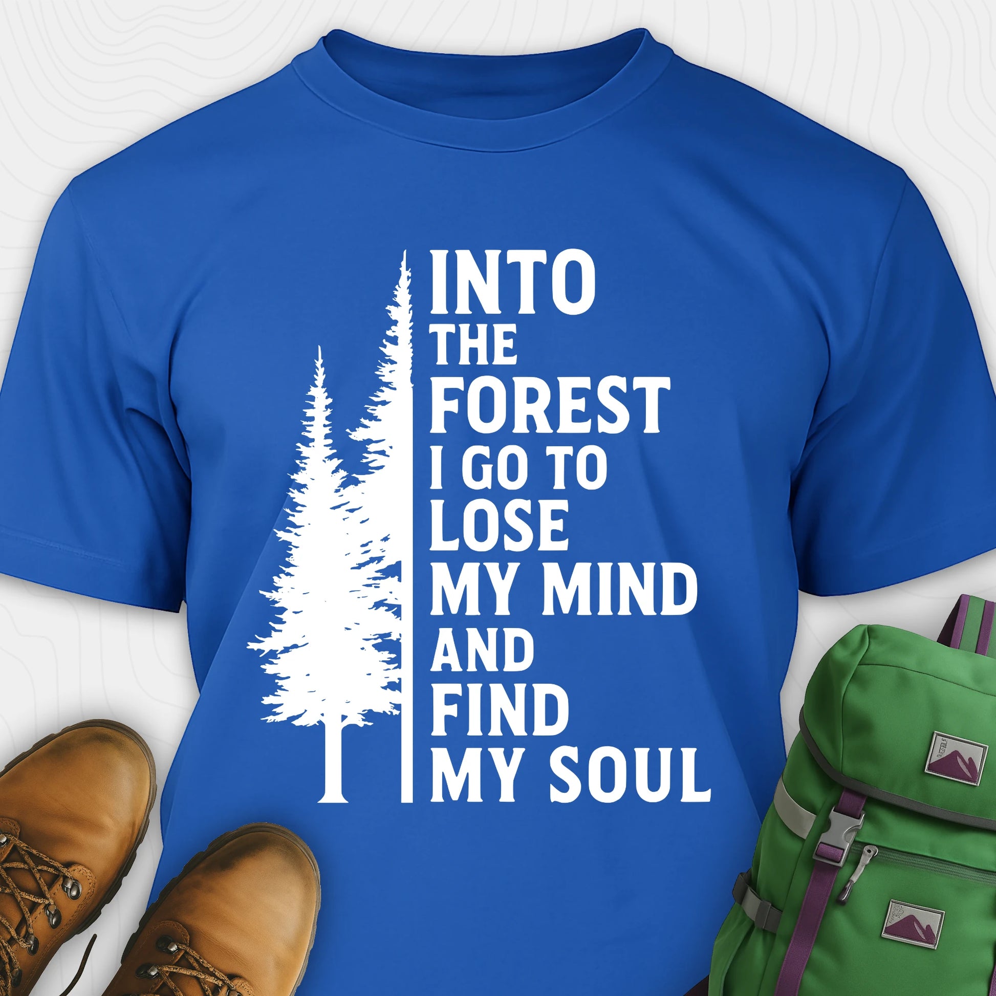 Blue into the forest I go t-shirt with white forest graphic and tall trees design