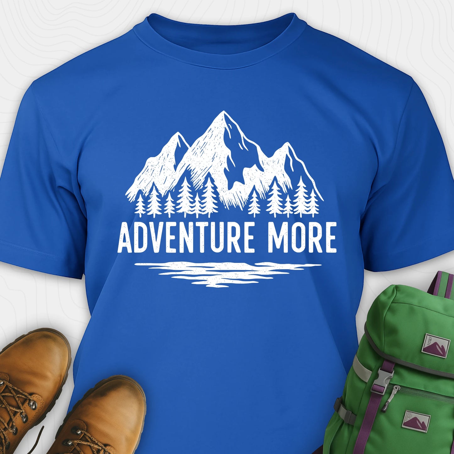 Blue adventure t-shirt with white mountain and tree graphic on a soft cotton tee