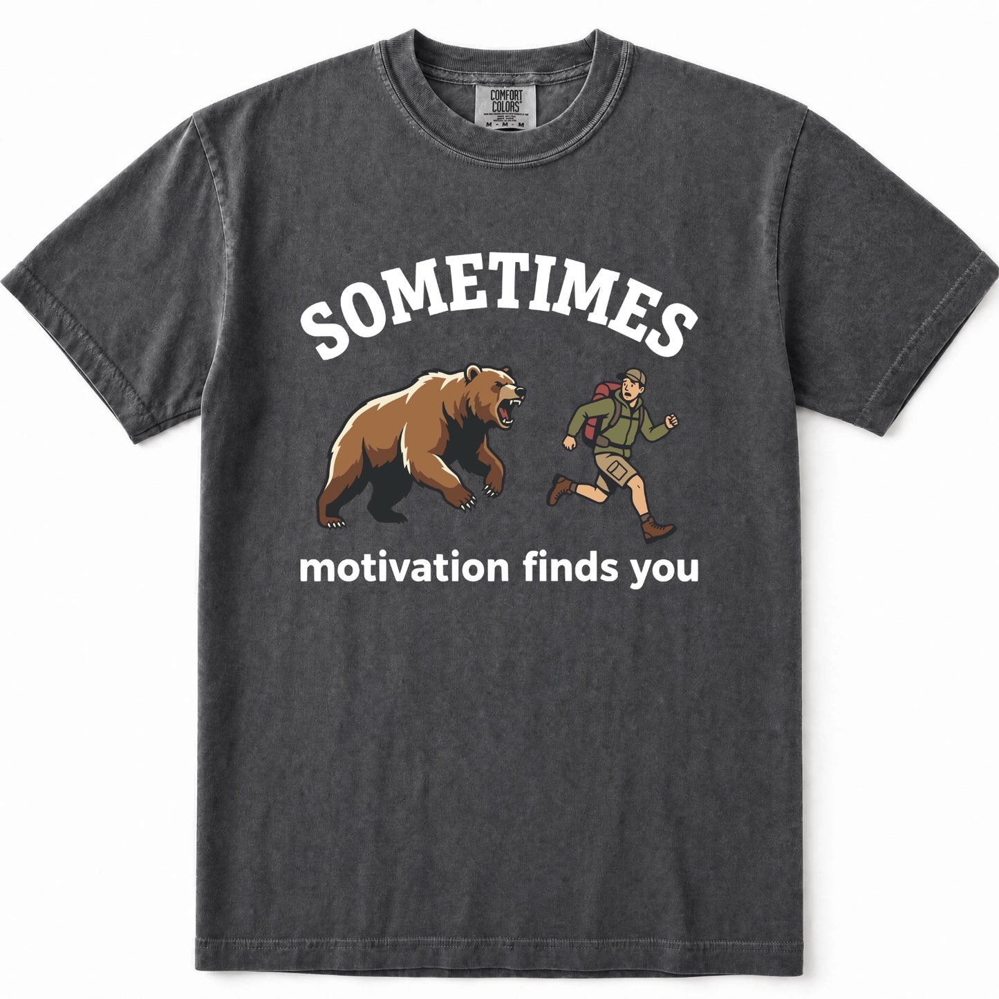 Pepper acid-wash graphic t-shirt featuring a brown grizzly bear and a hiking trail guide illustration with the text 'SOMETIMES motivation finds you' printed in white.