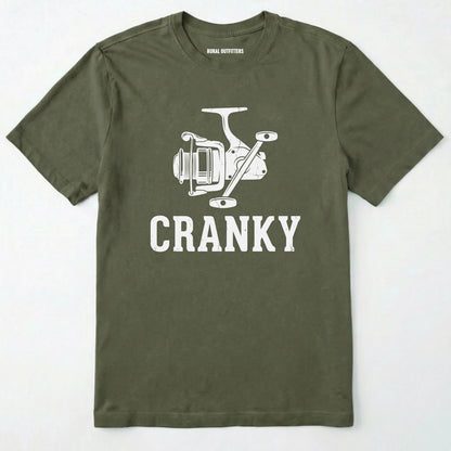 Military Green t-shirt with white fishing reel graphic and 'cranky' text on a white background