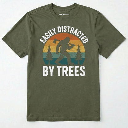 Military Green funny sasquatch shirt featuring bigfoot silhouette and trees on a white background.