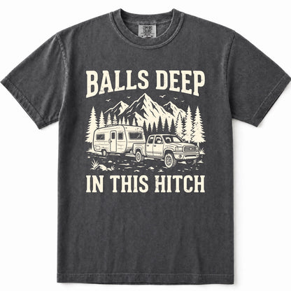 Pepper graphic t-shirt featuring a cream-colored print of a pickup truck towing a camper trailer with mountains and pine trees in the background. The text reads 'BALLS DEEP' above the graphic and 'IN THIS HITCH' below.
