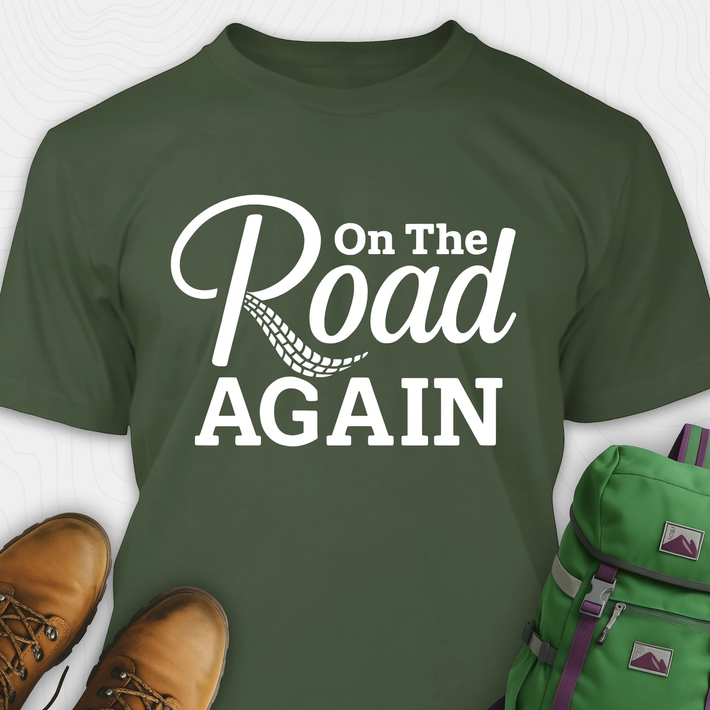 Green road trip t-shirt with “on the road again” white text