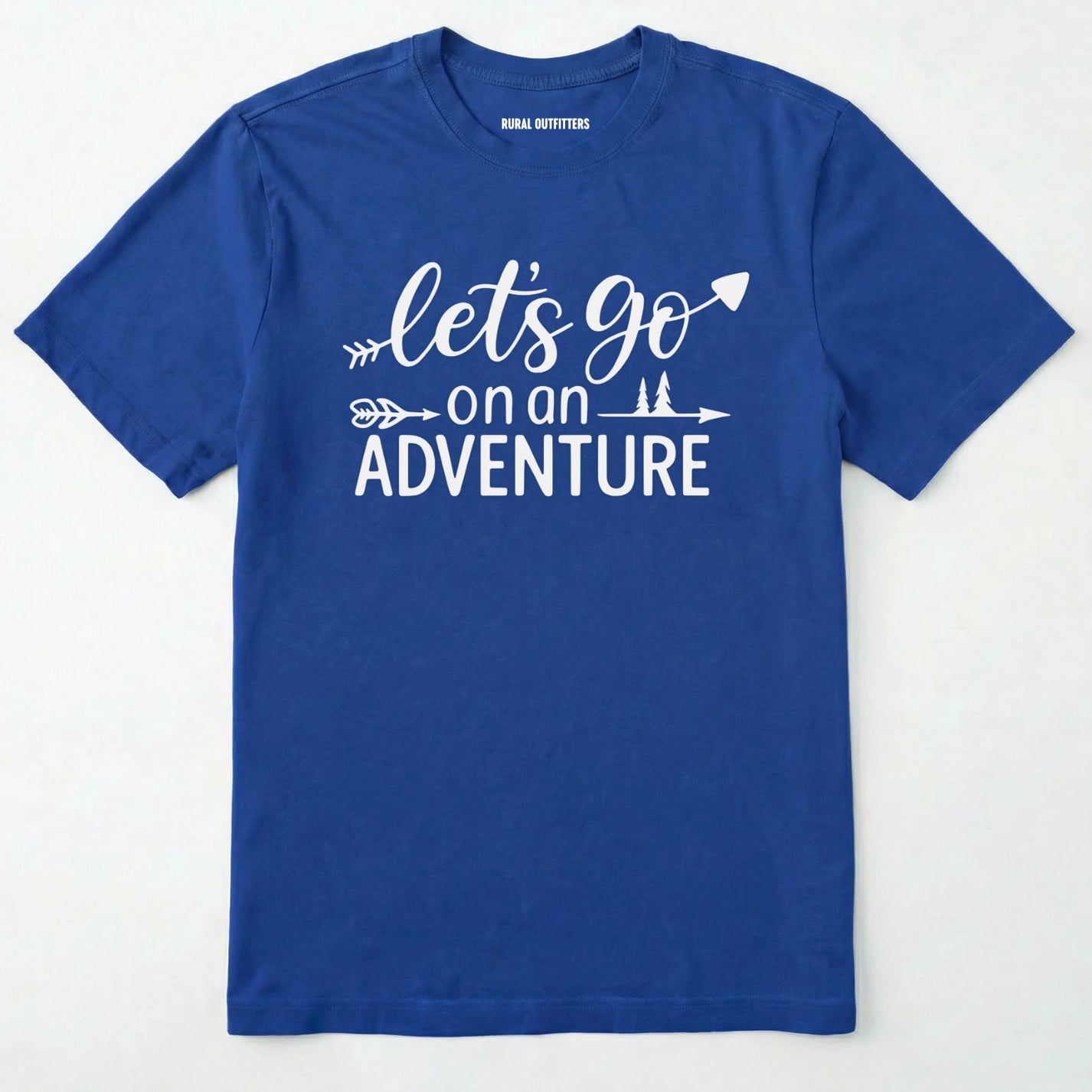 Royal lets go on an adventure shirt with an arrow and trees graphic on a light grey background.