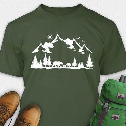 Military green wildlife t-shirt with white mountain and bear design, paired with brown boots and a green backpack.