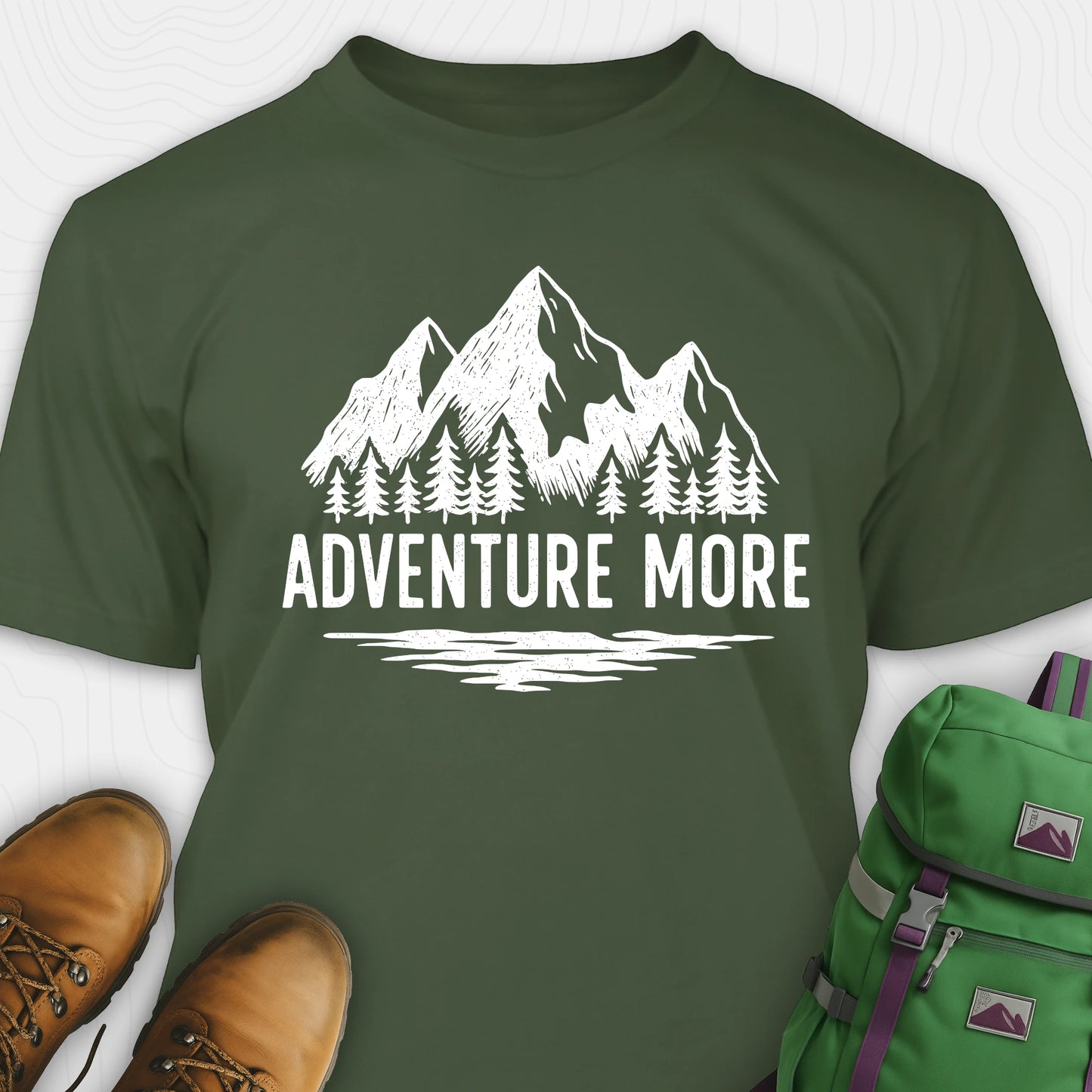 Green adventure t-shirt with white mountain and tree graphic on a soft cotton tee