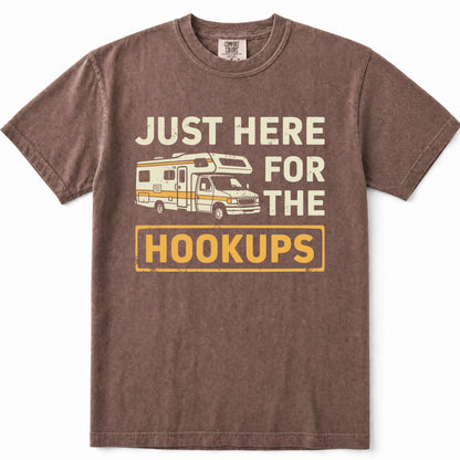 Espresso graphic t-shirt featuring a vintage-style camper van illustration and the text 'JUST HERE FOR THE HOOKUPS' in cream and yellow.