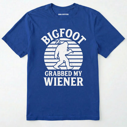 Royal bigfoot grabbed my wiener t-shirt with a funny design and text, on a plain white background.