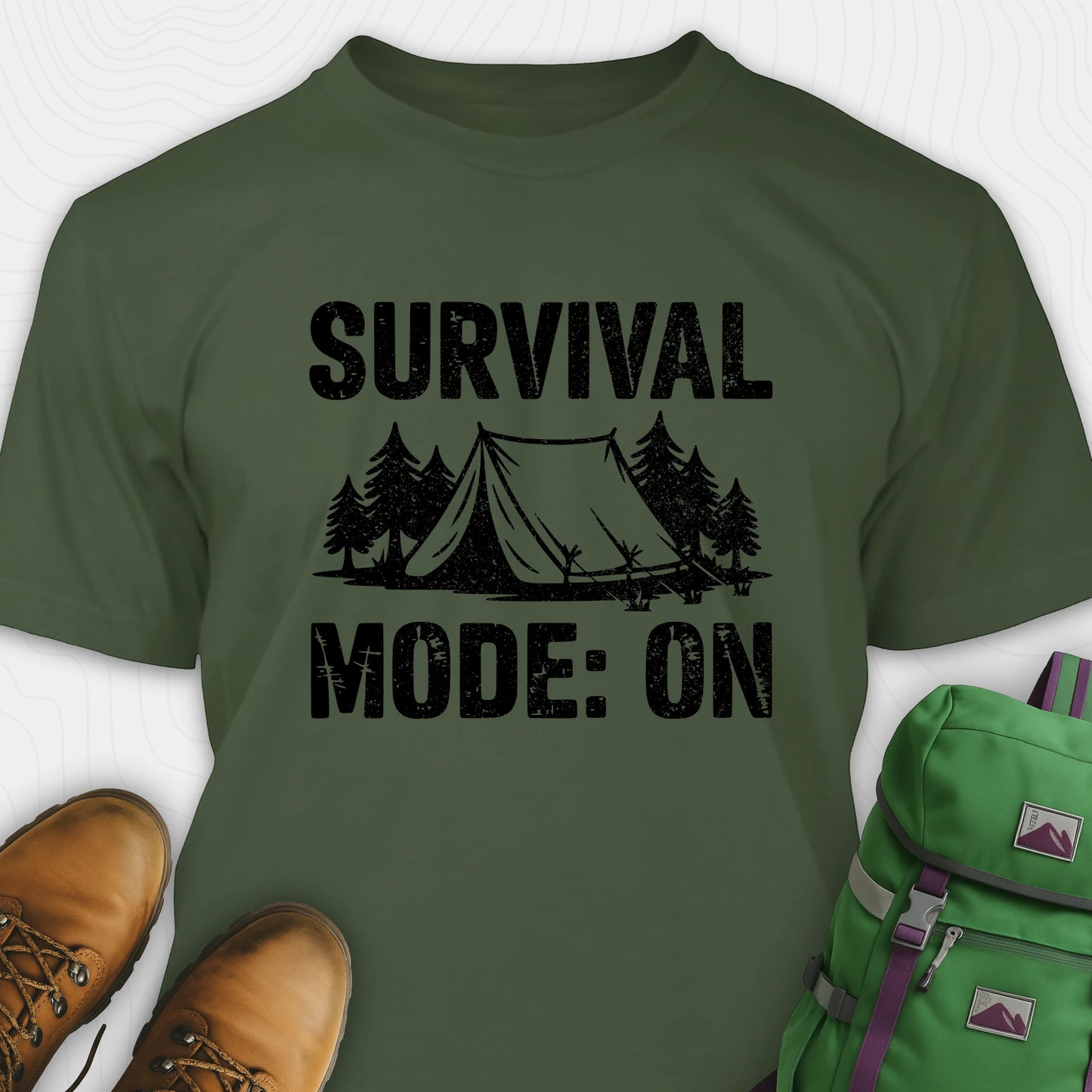 Green bushcraft shirt with survival mode on text, featuring tent and pine tree design
