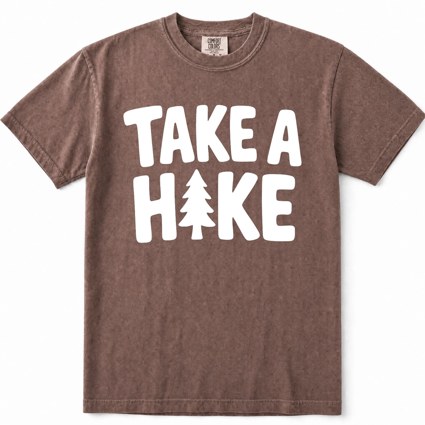 Espresso short-sleeve crewneck t-shirt with a white graphic print that reads 'TAKE A HIKE' with a pine tree icon replacing the letter 'I'.