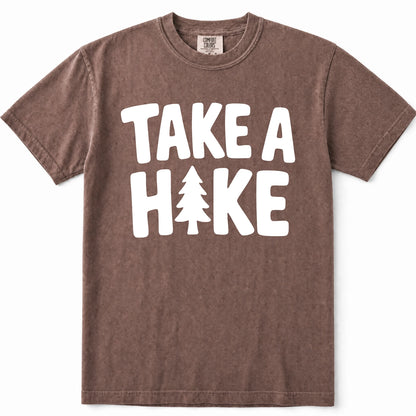 Espresso short-sleeve crewneck t-shirt with a white graphic print that reads 'TAKE A HIKE' with a pine tree icon replacing the letter 'I'.