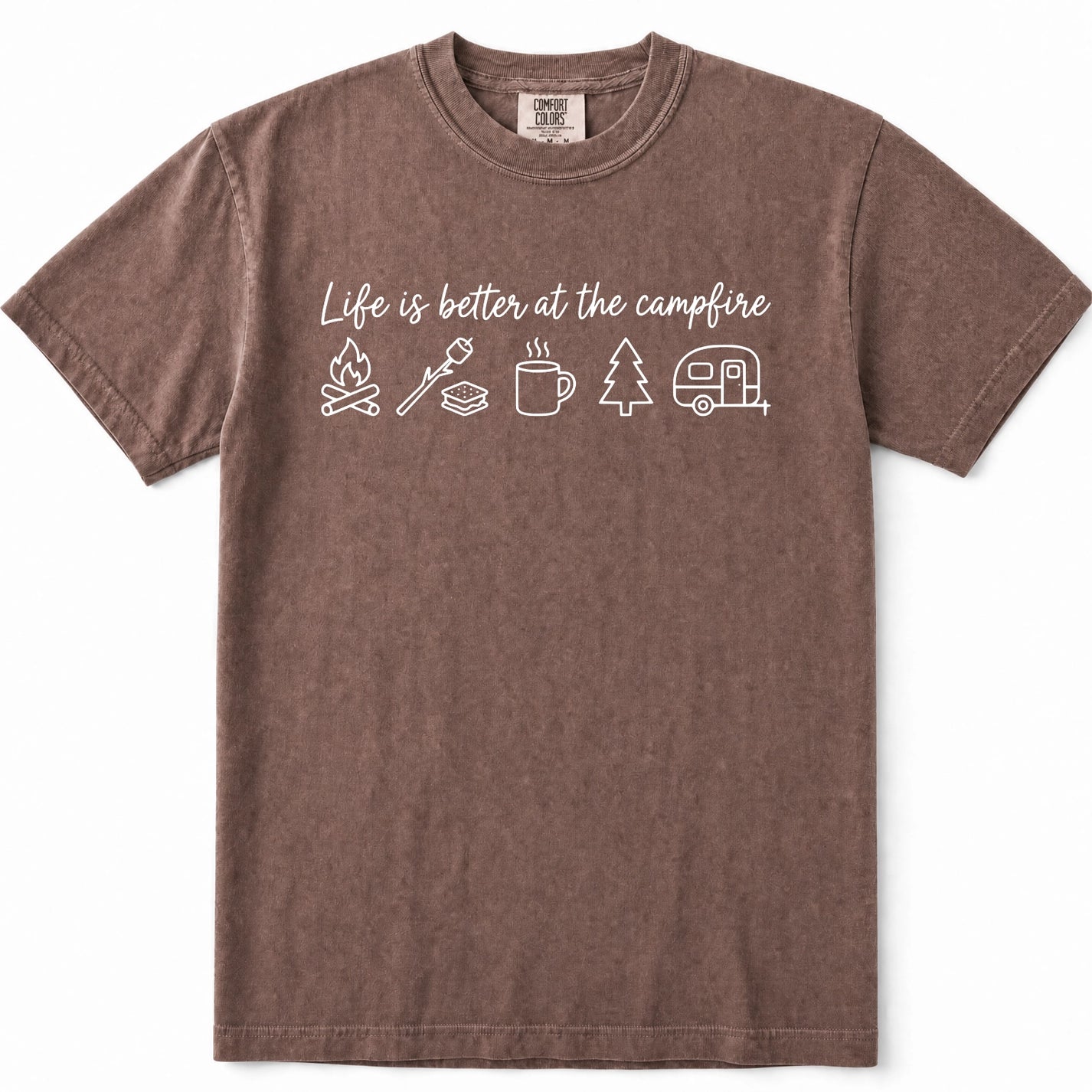 Espresso short-sleeve crewneck t-shirt in a washed, heathered brown color, featuring a white graphic print on the chest that reads 'Life is better at the campfire' above simple icons of a campfire, roasting marshmallow, mug, pine tree, and camper trailer.