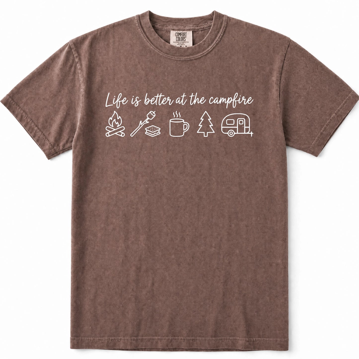Espresso short-sleeve crewneck t-shirt in a washed, heathered brown color, featuring a white graphic print on the chest that reads 'Life is better at the campfire' above simple icons of a campfire, roasting marshmallow, mug, pine tree, and camper trailer.