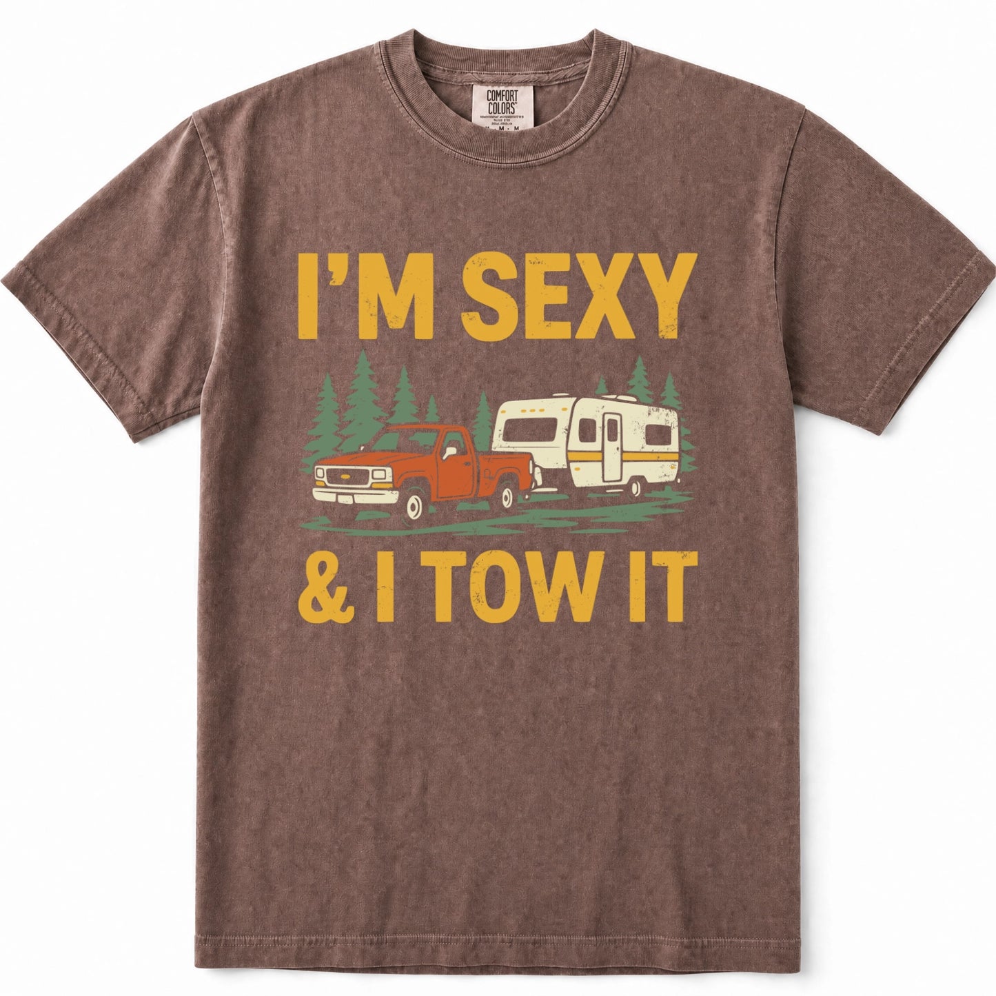 Espresso heathered t-shirt with a graphic print that reads 'I'M SEXY & I TOW IT' in yellow text, featuring an illustration of an orange pickup truck towing a cream camper trailer with green pine trees in the background.
