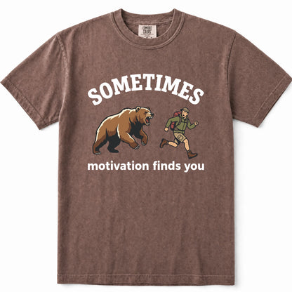 Espresso acid-wash graphic t-shirt featuring a brown bear and a hiking hiker with the text 'SOMETIMES motivation finds you' printed on the front.