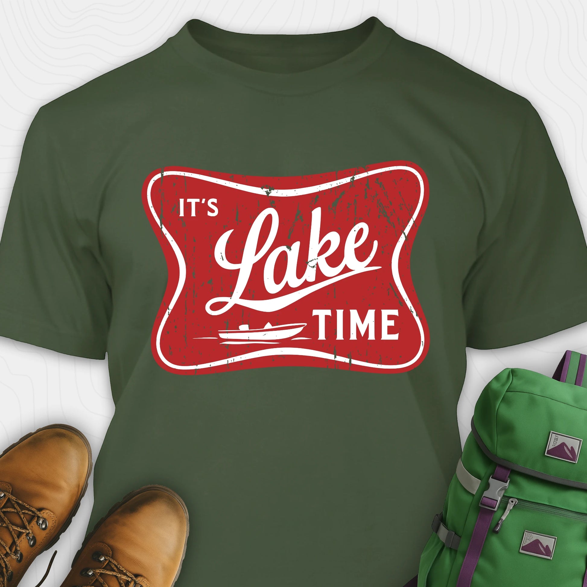 Green lake t-shirt with retro “It’s Lake Time” graphic, featuring a red vintage lake badge design