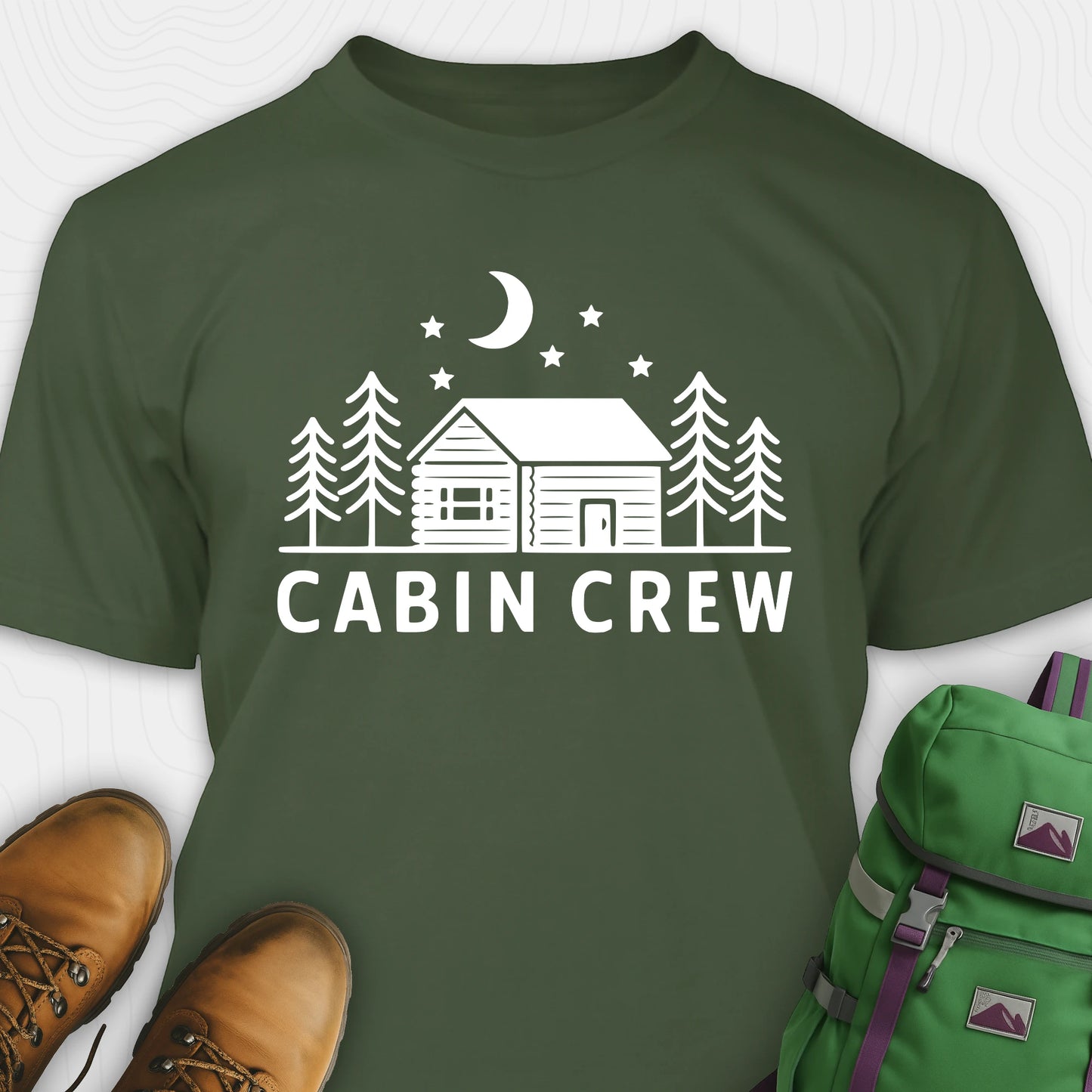Green cabin crew t-shirt with moon, pine trees and cabin design