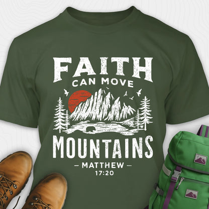 Green bible verse t-shirt with 'Faith can move mountains' design and hiking boots and backpack on a white background