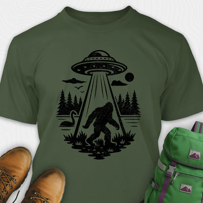 Green monster shirt with bigfoot, forest scene, and ufo beam graphic