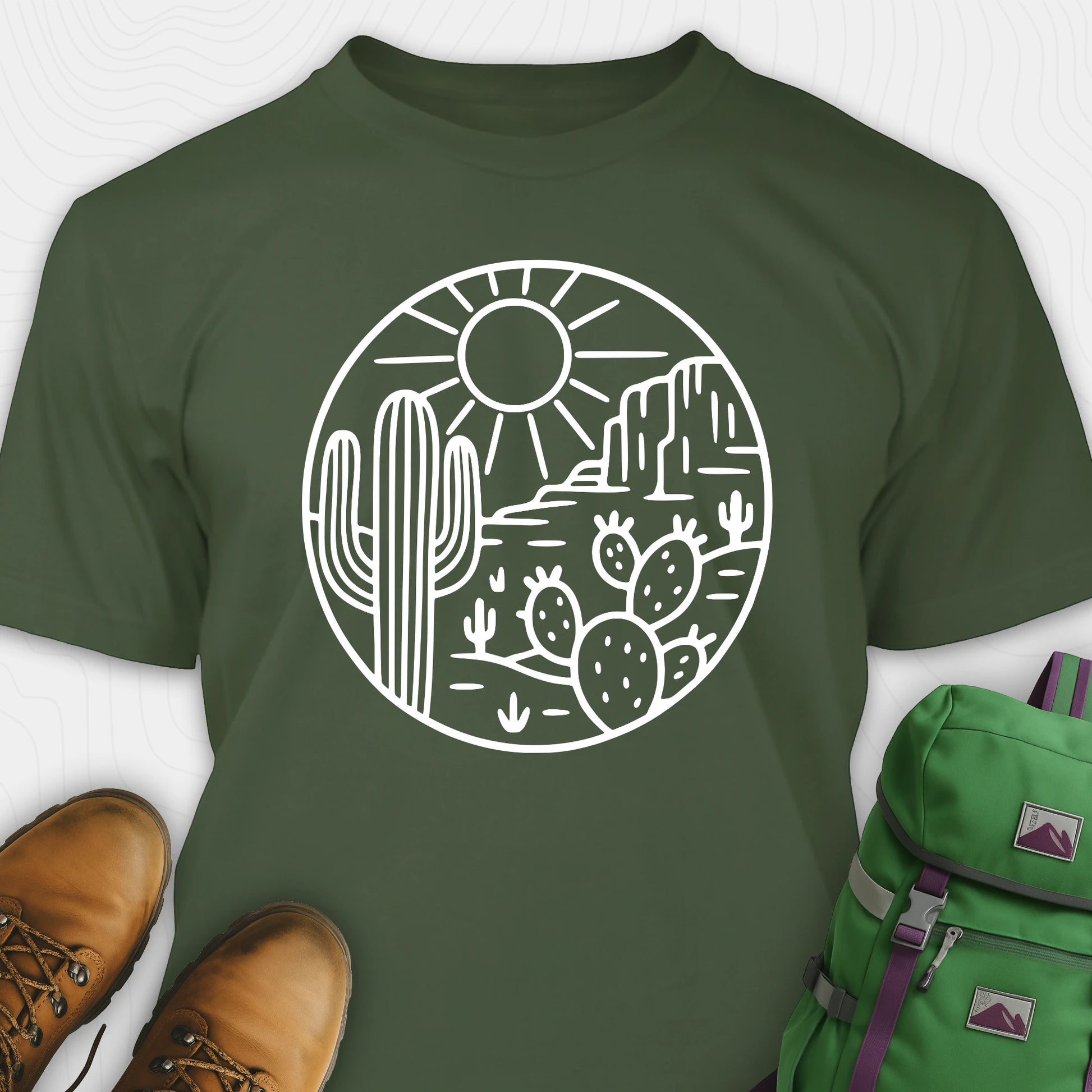 Green cactus shirt featuring desert landscape and cactus illustration