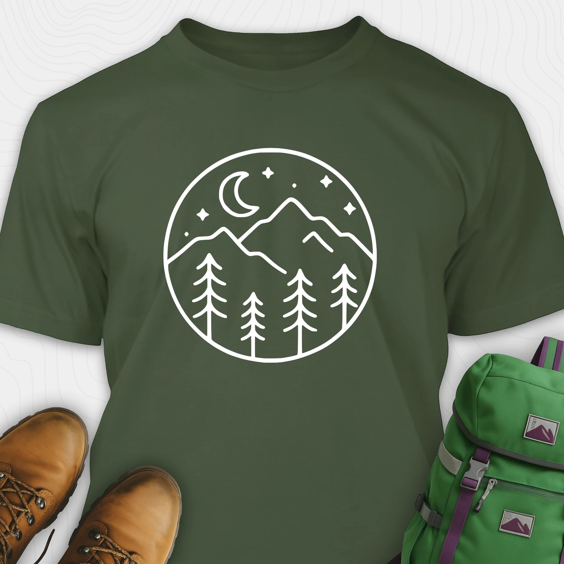 Green moon and stars shirt with minimalist mountain and forest design