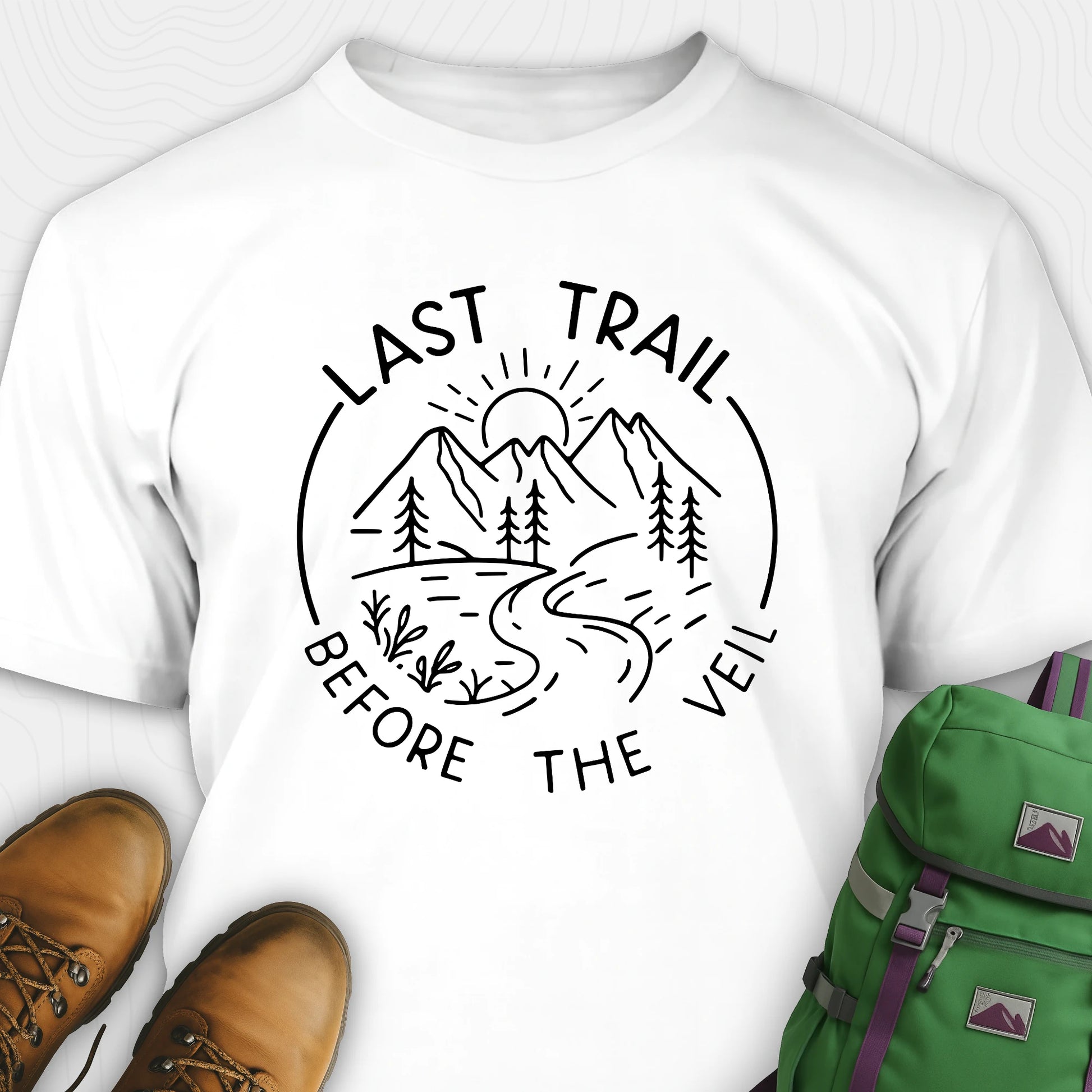 White nature-themed Last Trail Before the Veil shirt with line-art mountain scene.