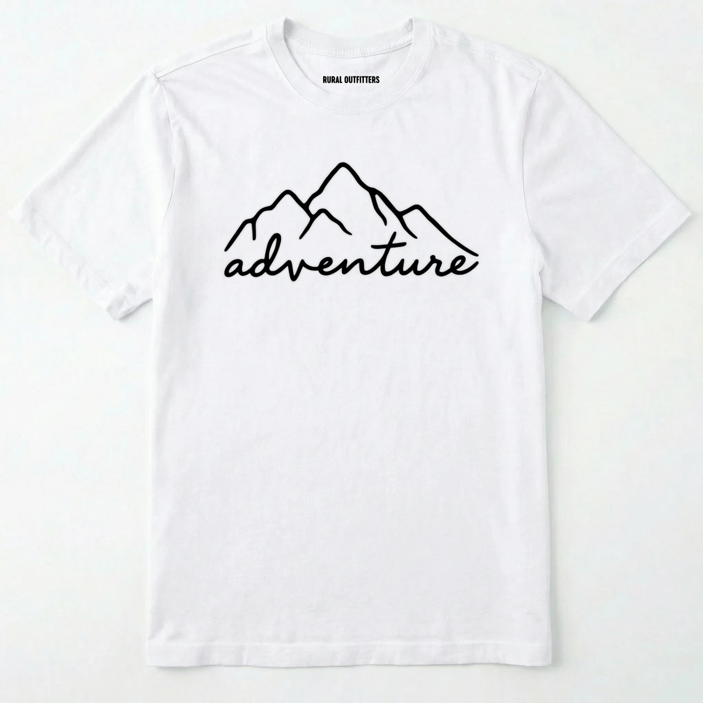White adventure shirt with mountain design and 'adventure' text on a white background.
