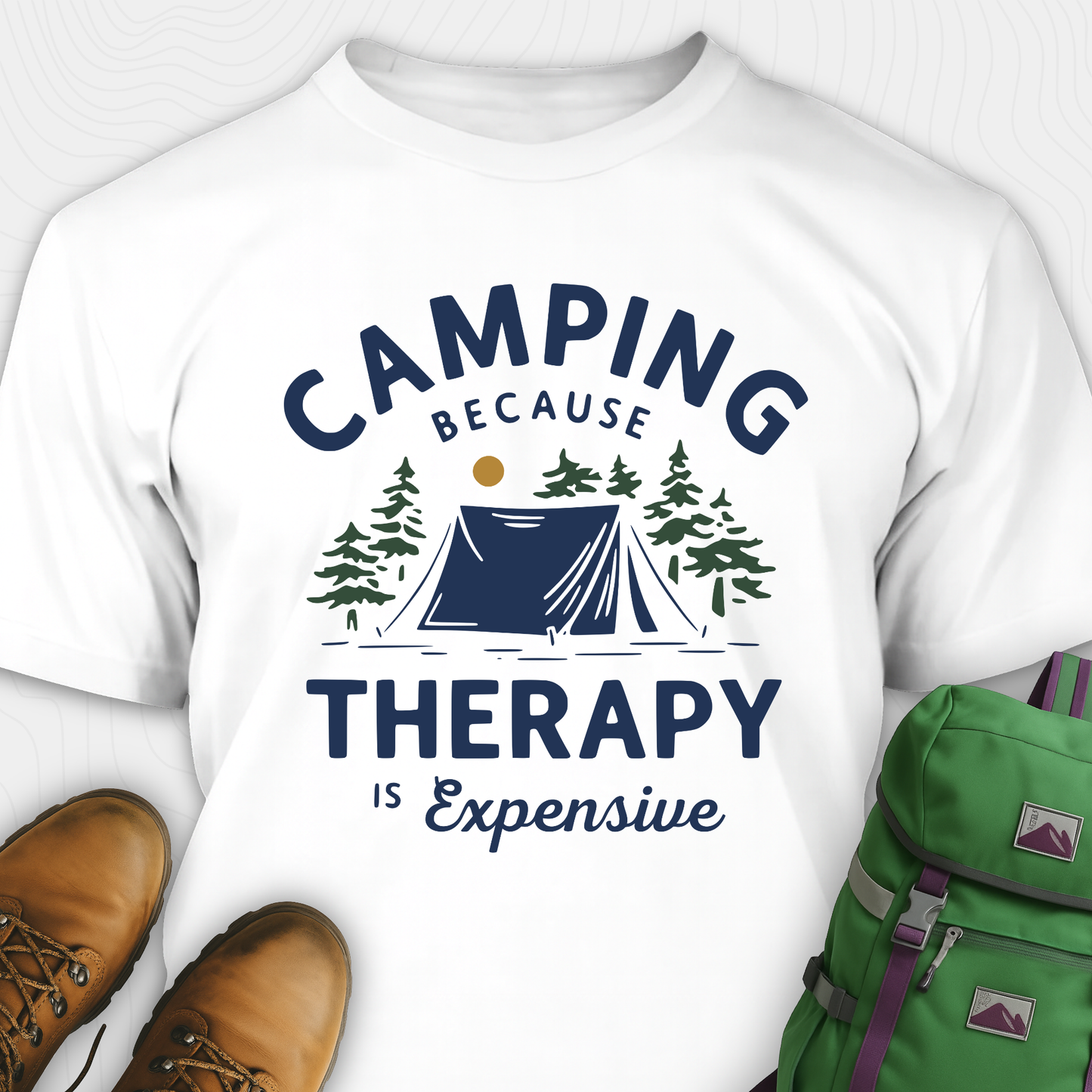 White camping therapy shirt with tent and pine trees design and "camping because therapy is expensive" text